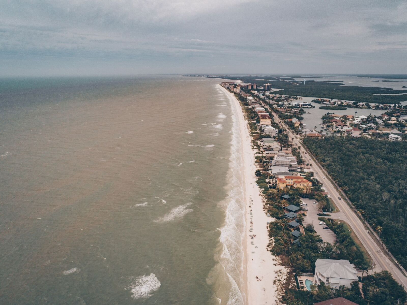 Aerial view of the Southwest Florida Gulf coast beach and homes